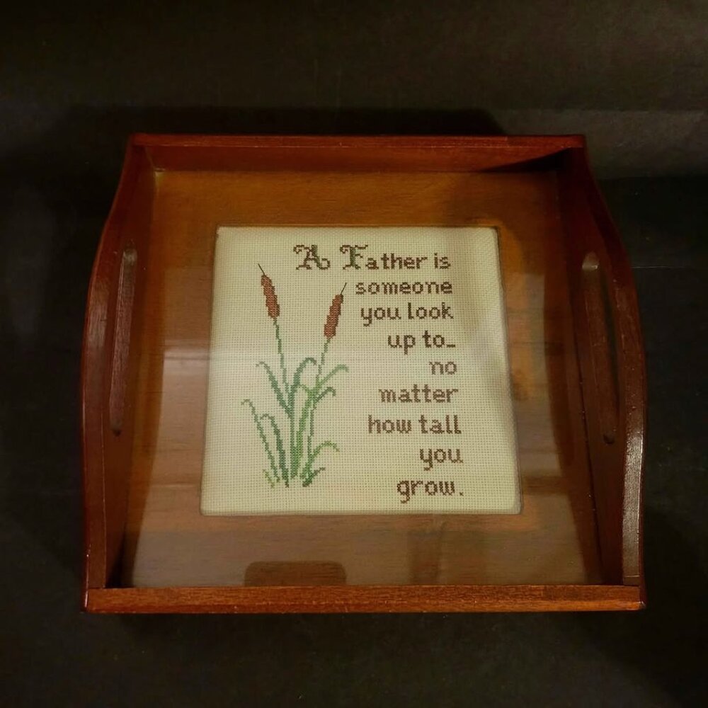 Vintage Cross-Stitch In A Small Wooden Tray Under Glass